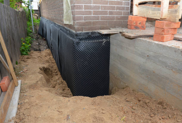 Happy homeowners after waterproofing job in New Hyde Park